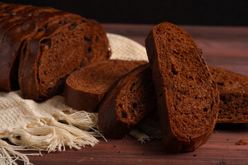Sliced Sourdough Rye Bread, Freshly dark bread. Perfect for recipe, article, catalogue, or any commercial purposes. with copy space.