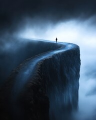 Mysterious road through foggy landscape.