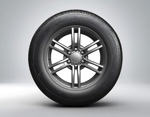 Obraz premium A single black tire with silver alloy wheel