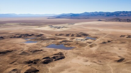 Captivating aerial panoramic view of the expansive desolate dry lakebed located near the mysterious and restricted Area 51 compound  This remote barren landscape exudes an eerie