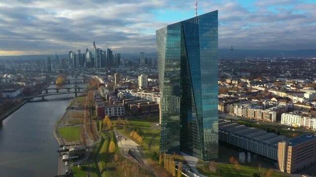 Dolly Flight through and Panorama at Frankfurt am Main, Germany. Skyline, New Skyscrapers, Headquarters of the European Bank, Urban Canyon. Aerial Pedestal in Establishing Drone Shot. Forward movement
