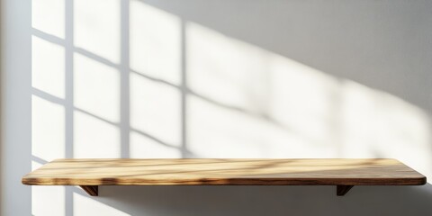 Mockup for showcasing branding products, cosmetics, food, or jewelry. The mockup features an empty table against a bright backdrop, enhanced by window shadows on the wall and wooden table.