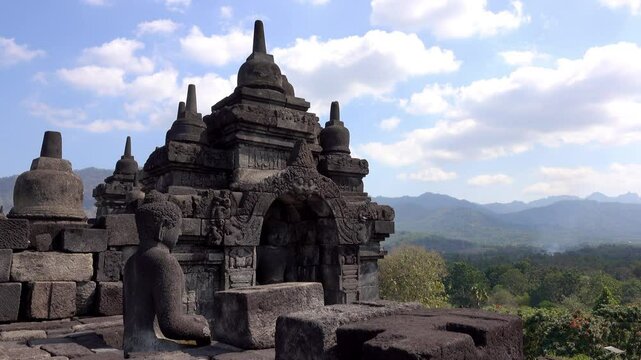Buddha statue on top of Borobudur Temple in Indonesia.