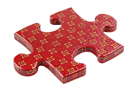 Glossy red puzzle piece with intricate gold floral patterns. A shiny, decorative element that feels luxurious and playful, isolated on a transparent background