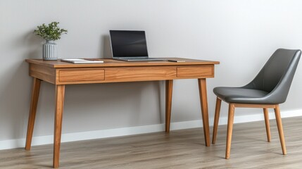 Modern workspace with a desk, laptop, and chair in a minimalist setting.