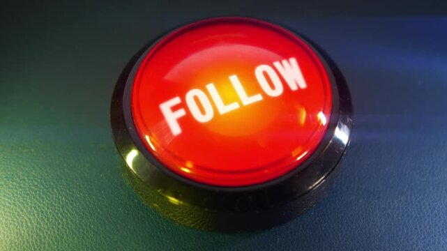 Pressing the big red button labeled with the message "Follow"