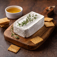 Rustic Goat Cheese on Wooden Board with Herbs