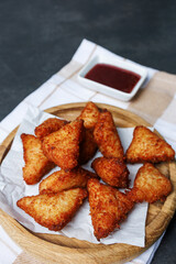 chicken nuggets with red sauce, ketchup, on a dark background with a white kitchen towel, fast food, snack