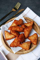 chicken nuggets with red sauce, ketchup, on a dark background with a white kitchen towel, fast food, snack