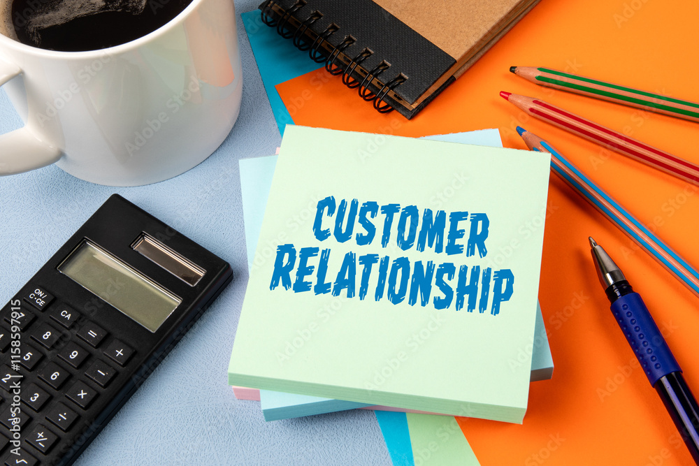 Wall mural customer relationship. notepad with text on office table