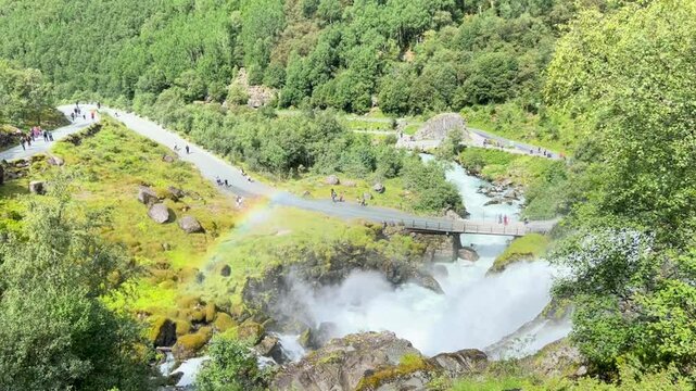 waterfall and rainbow in the mountains, Briksdalsbreen, Norway