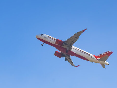 New Delhi, India, November 10 2024 - Vistara Airbus A320 neo take off from Indra Gandhi International Airport Delhi, Vistara domestic aeroplane flying in the blue sky during day time
