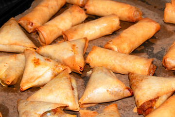 Close Up of Party Food Mini Appetisers Samosa and Spring Rolls
