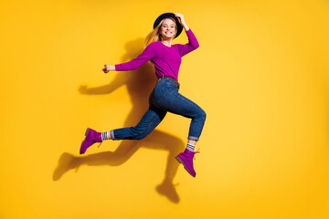 Profile side full length body size view of her she nice-looking attractive lovely fascinating fashionable cheerful careless carefree girl having fun isolated over bright vivid shine orange background