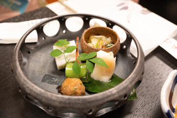 Close-up of Japanese crab meal served on a wooden table in Tokyo, Japan.