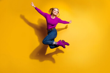 Obraz premium Full length body size view of her she nice attractive cool lovely cheerful cheery optimistic girl having fun free time isolated over bright vivid shine orange background