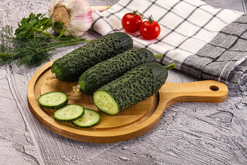Raw green cucumbers with slices