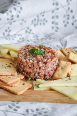 plate of steak tartar with bread. homemade recipe