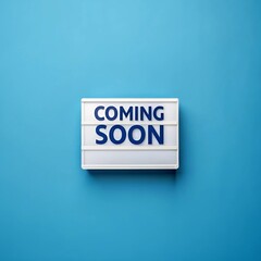 Neon sign displaying the words "Coming Soon" in bright colors against a dark background
