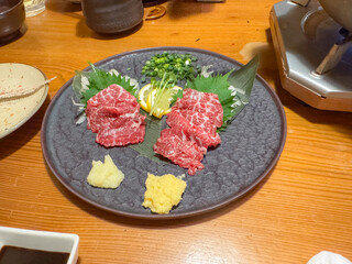 Slices of horse meat fillets served in Tokyo, Japan