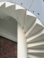 A staircase architecturally connecting upper and lower floors, creating a vertical link between spaces.