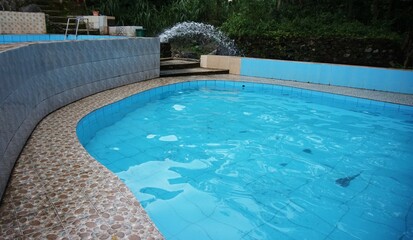 beautiful and fresh swimming pool, with blue and clear water