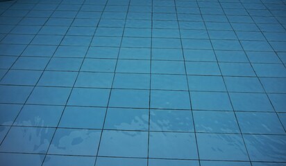 swimming pool tiles, checkered swimming pool tiles with clean and clear blue water