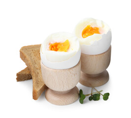 Soft boiled eggs and bread isolated on white