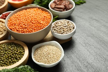 Superfood. Different healthy food products on grey table, closeup. Space for text