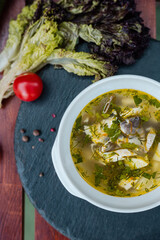 vegetable soup with fish served with fresh salad