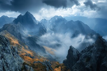 Majestic Mountain Peaks Enveloped In Misty Clouds