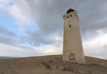 Rubjerg Knude Lighthouse in northern Denmark, nearly engulfed by sand dunes, tells a story of...