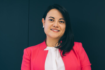 Positive female entrepreneur using mobile phone