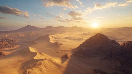 Fototapeta premium Golden desert sunset landscape with mountains and sand dunes.