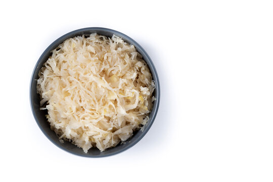 Sauerkraut in a bowl isolated on white background. Top view. Copy space