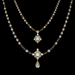 A gold and diamond necklace with a crystal pendant