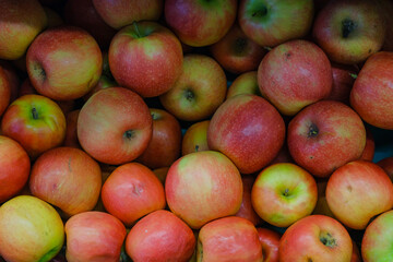 Vibrant Red Apples in a Market Basket. A colorful display of fresh red apples at a local market.