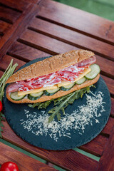 hot dog witn sausage and fresh vegetables