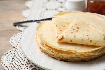 Stack of delicious crepes on table, closeup