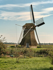 Fototapeta premium Traditional Windmill in the Oudkerkerpolder, Friesland, Netherlands