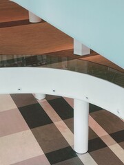 Curved Staircase with Glass and Wooden Design