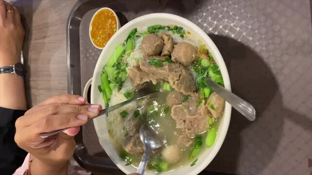 a bowl of bakso indonesia on the table