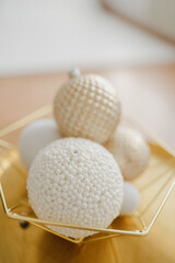 New Year's toys on a green tree for Christmas. Garlands with lanterns glow and with decorations. Magical atmosphere and miracle during winter holidays