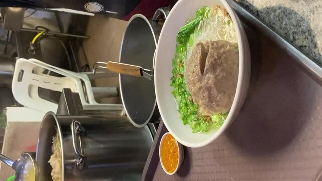 a bowl of bakso indonesia on the table