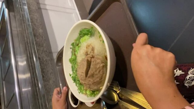 a bowl of bakso indonesia on the table