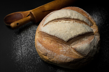 Freshly baked bread on a dark background. Fresh baked goods