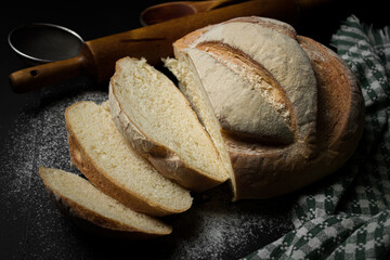 Freshly baked bread on a dark background. Fresh baked goods