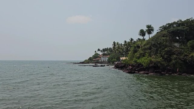 Dona Paula Pier, Dias Beach Access, Dona Paula, Panaji the Dona Paula viewpoint A picturesque seaside view with rocky cliffs, palm trees, and calm waters,  Goa