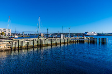 Fototapeta premium A view across the estuary from the waterfront at Halifax, Nova Scotia, Canada in the fall