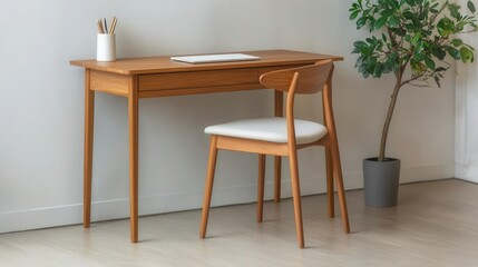 Teak wood desk with clean lines, paired with a simple chair, for minimal home office, sustainable workspace